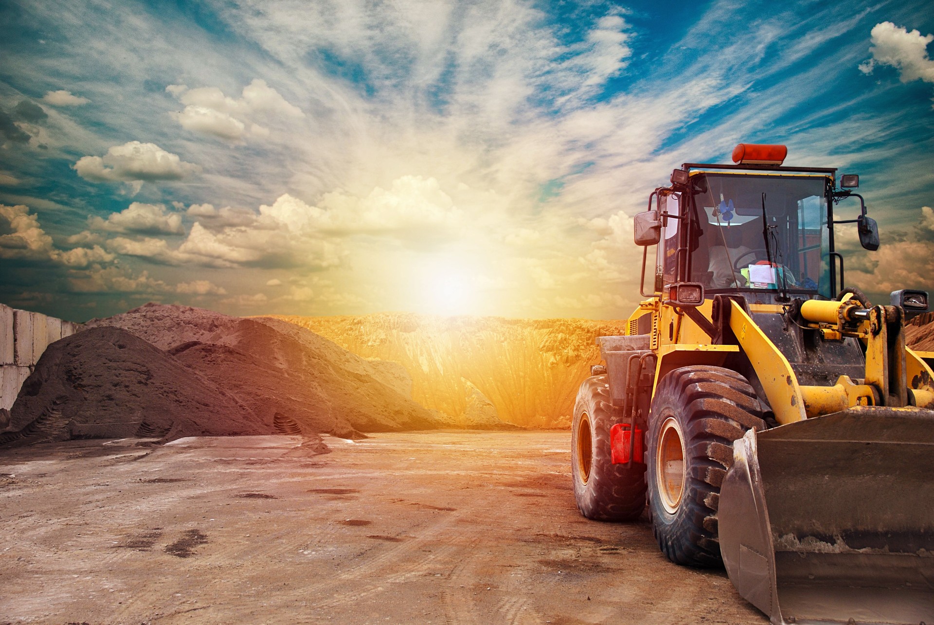 Heavy equipment machine wheel loader on construction site . Precast and concrete industry
